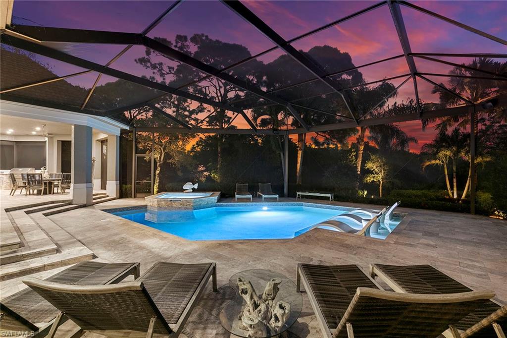 927 Barcarmil Way Naples, FL 34110 - Photo 44 of 48 a view of a swimming pool with a patio