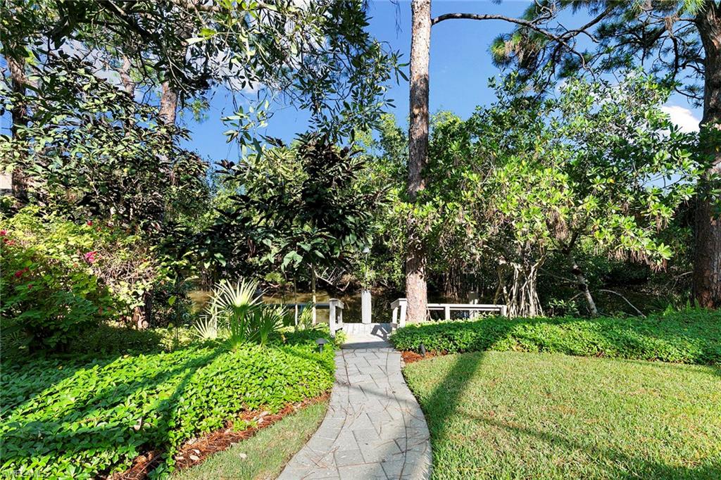 927 Barcarmil Way Naples, FL 34110 - Photo 47 of 50 View of front of house featuring a front yard