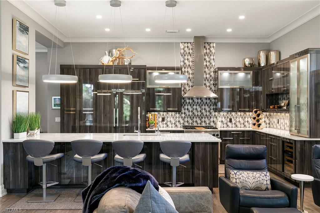 927 Barcarmil Way Naples, FL 34110 - Photo 9 of 48 a kitchen with lots of counter top space