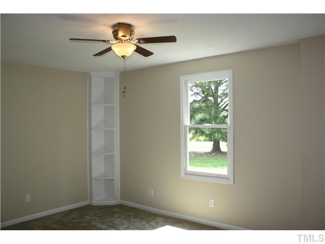 2753 Micro Road West Selma, NC 27576 - Photo 12 of 16 LARGE MASTER SUTIE WITH CORNER BUILT IN SHELVES