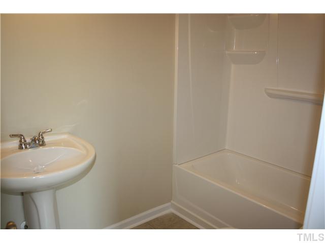 2753 Micro Road West Selma, NC 27576 - Photo 14 of 16 BATHROOM WITH PEDESTAL SINK