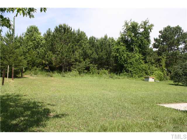 2753 Micro Road West Selma, NC 27576 - Photo 4 of 16 LARGE BACK YARD WITH NATURAL WOOD BUFFER AND LOTS OF PRIVACY