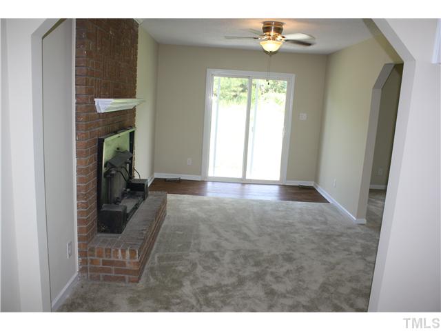 2753 Micro Road West Selma, NC 27576 - Photo 8 of 16 LARGE FAMILY ROOM WITH MASONARY FIREPLACE & WOOD BURNING STOVE