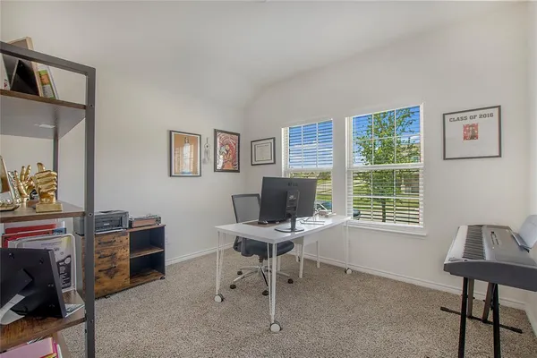 a work room with furniture and windows