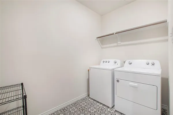 a view of storage and utility room with washer and dryer