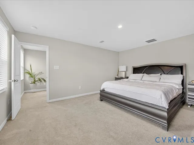 a bedroom with a bed and a table