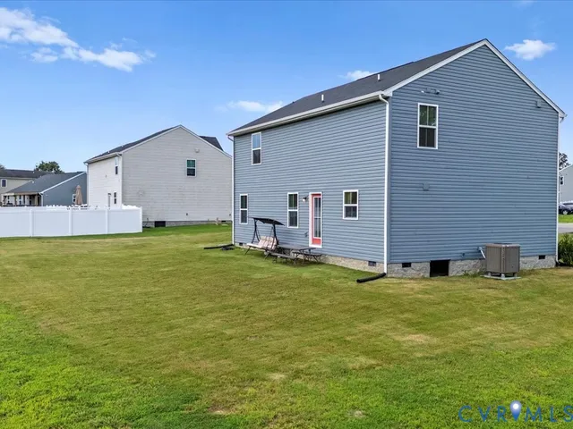 a view of a backyard with a garden and plants