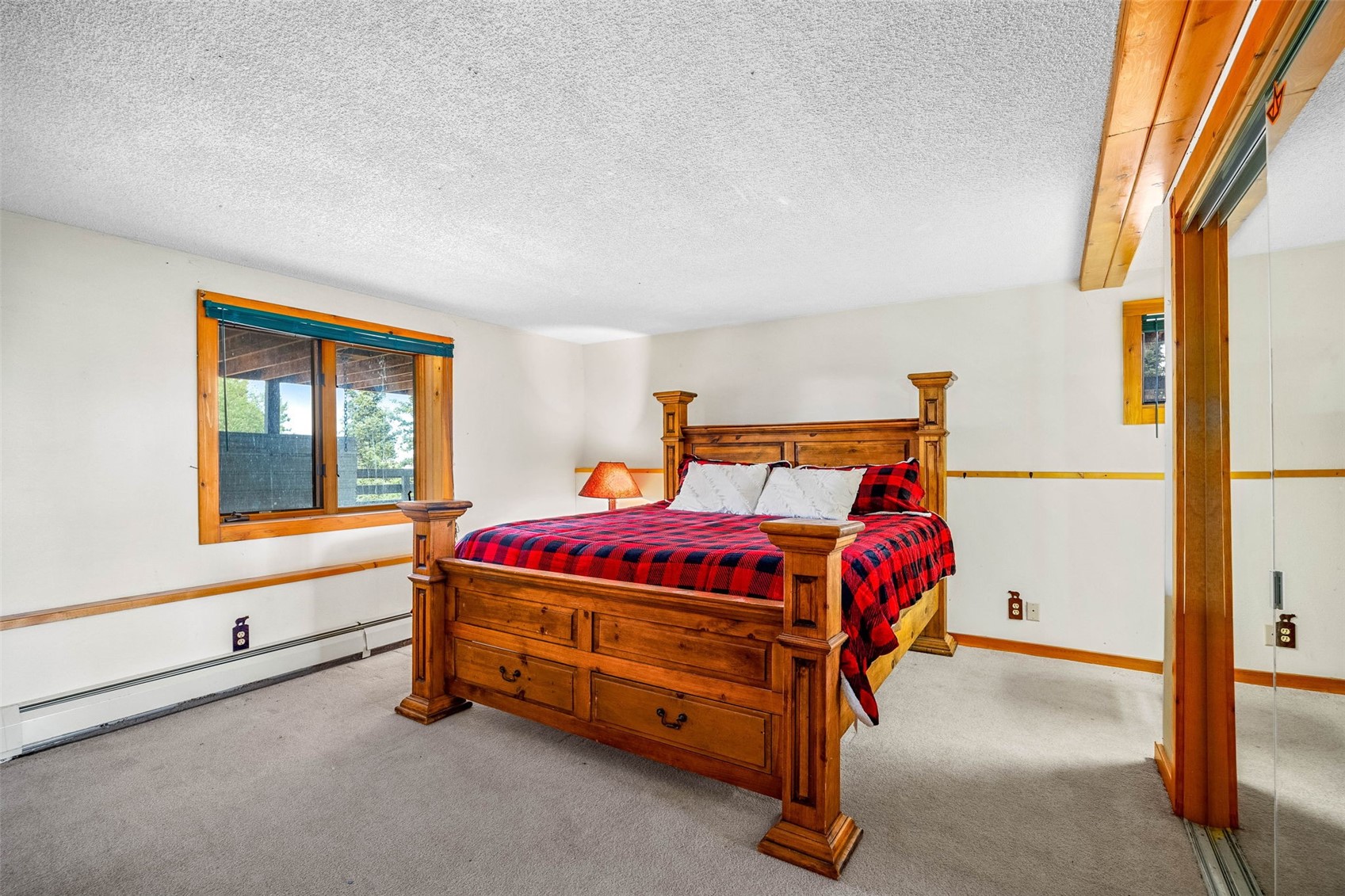 597 Sheep Ridge Road Fairplay, CO 80440 - Photo 34 of 50 a bed room with a bed and a window