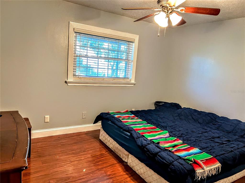 4515 Orangewood Loop East Lakeland, FL 33813 - Photo 15 of 39 a room with stairs and wooden floor