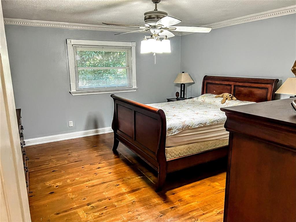 4515 Orangewood Loop East Lakeland, FL 33813 - Photo 17 of 39 a bedroom with bed and window