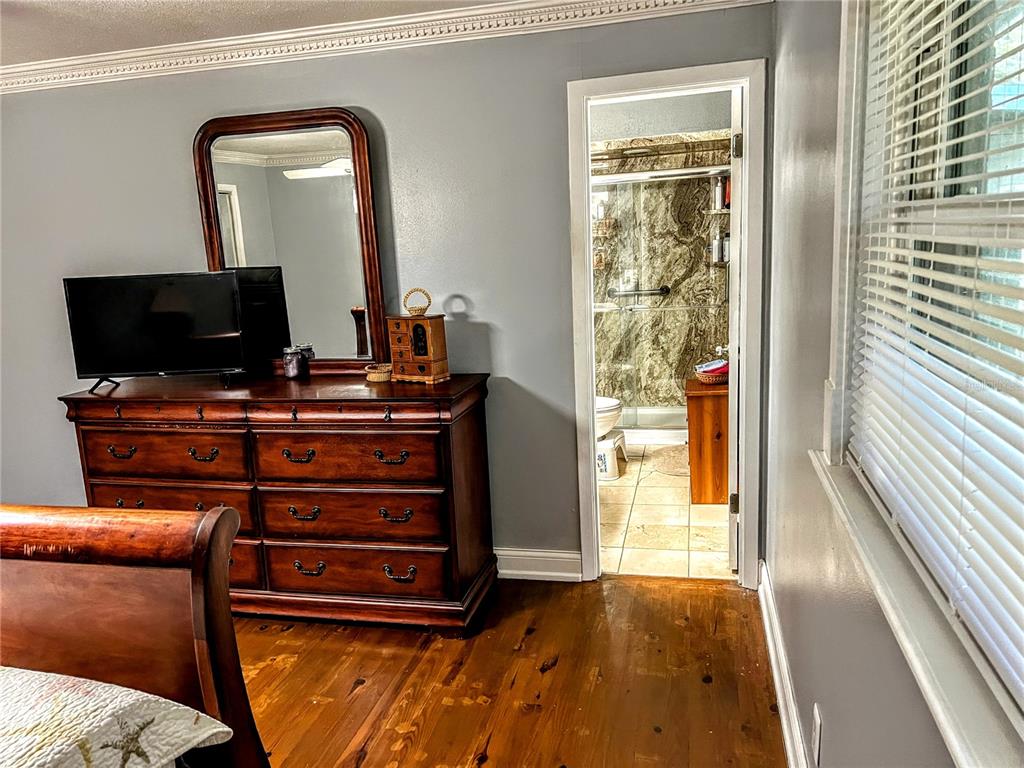 4515 Orangewood Loop East Lakeland, FL 33813 - Photo 19 of 39 a living room with furniture and a flat screen tv