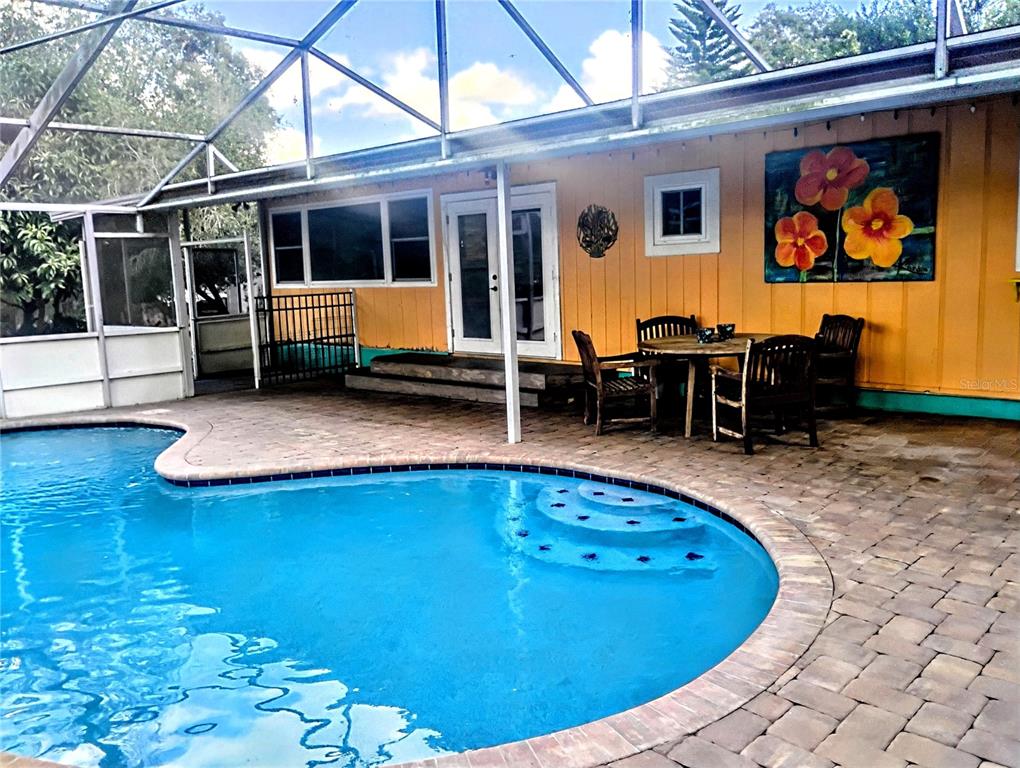 4515 Orangewood Loop East Lakeland, FL 33813 - Photo 2 of 39 a view of swimming pool with outdoor seating