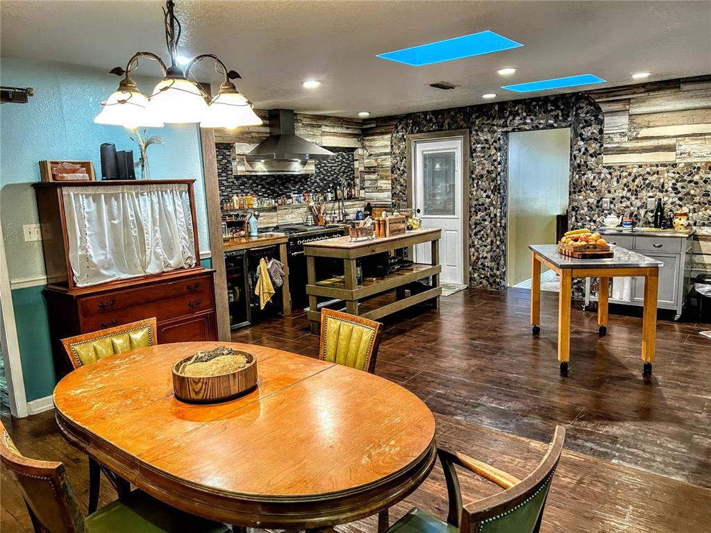 4515 Orangewood Loop East Lakeland, FL 33813 - Photo 22 of 39 a view of a dining room with furniture