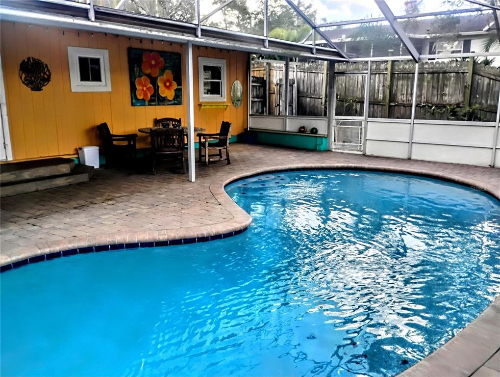 4515 Orangewood Loop East Lakeland, FL 33813 - Photo 32 of 39 a view of a house with backyard porch and sitting area