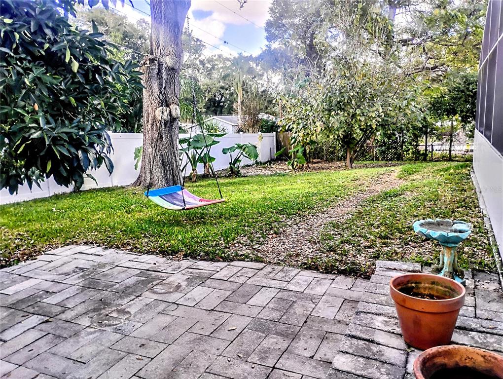 4515 Orangewood Loop East Lakeland, FL 33813 - Photo 36 of 39 a view of a backyard with garden and entertaining space