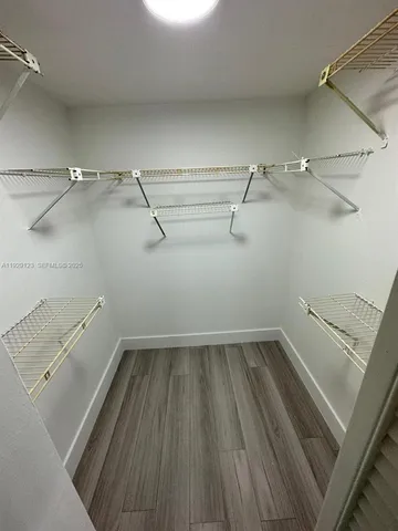 a view of a room with racks on the wall