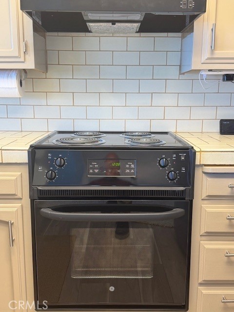 557 Lucerne Street Cayucos, CA 93430 - Photo 51 of 51 New stove/oven and hood
