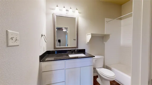 wooden floor in an empty room and a chandelier fan
