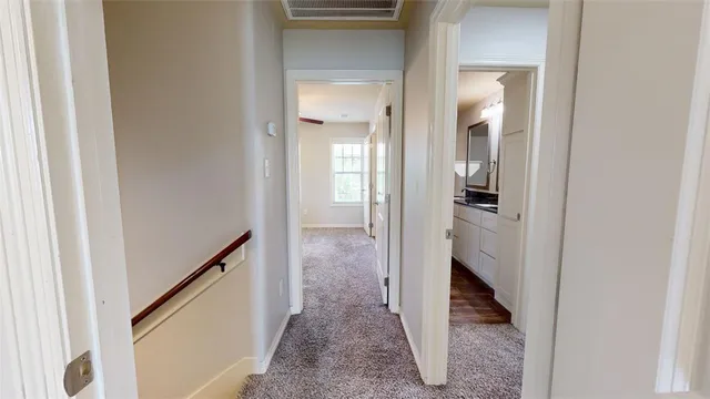 a bathroom with a granite countertop sink toilet and mirror
