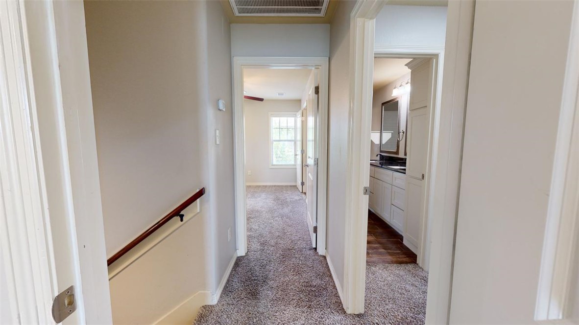 102 Richards Street College Station, TX 77840 - Photo 20 of 41 a view of a hallway with wooden floor and staircase