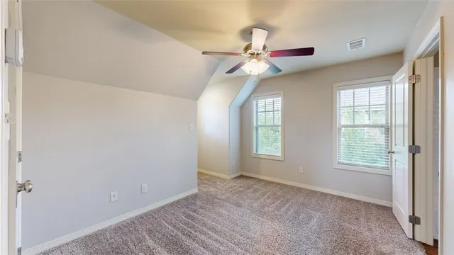 a view of a bathroom from a hallway