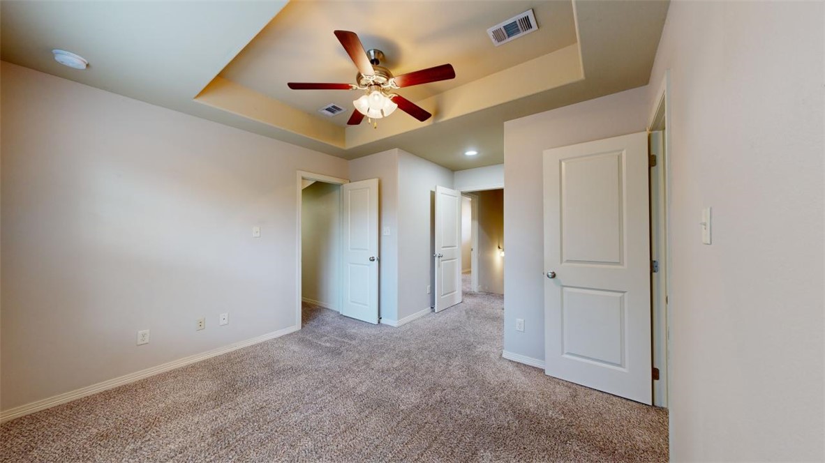102 Richards Street College Station, TX 77840 - Photo 27 of 41 an empty room with closet and a chandelier fan