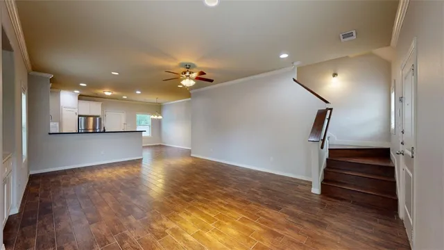 a view of kitchen and hall with wooden floor