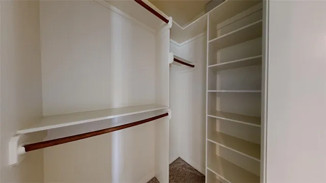 a white refrigerator freezer and a stove sitting inside of a kitchen