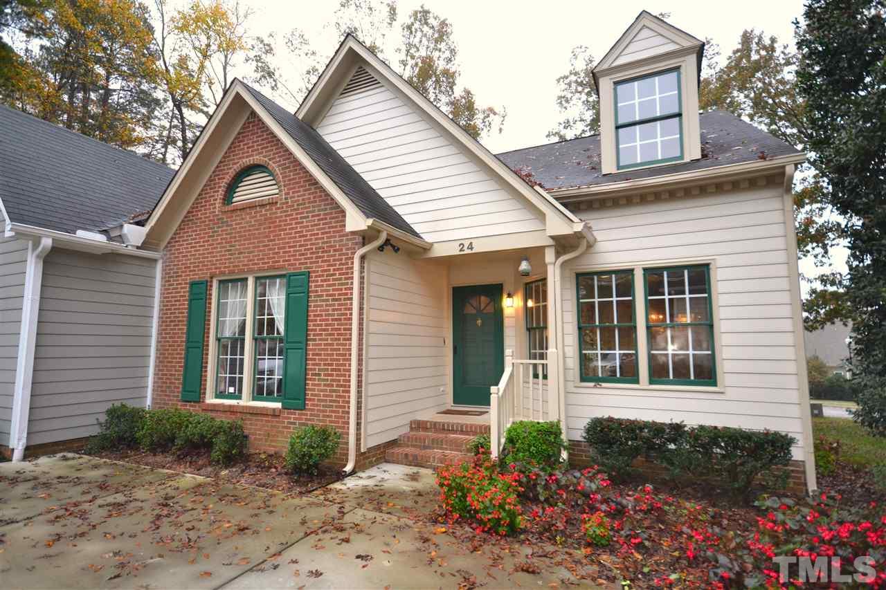 24 Renwick Court Raleigh, NC 27615 - Photo 1 of 20 a front view of a house with garden