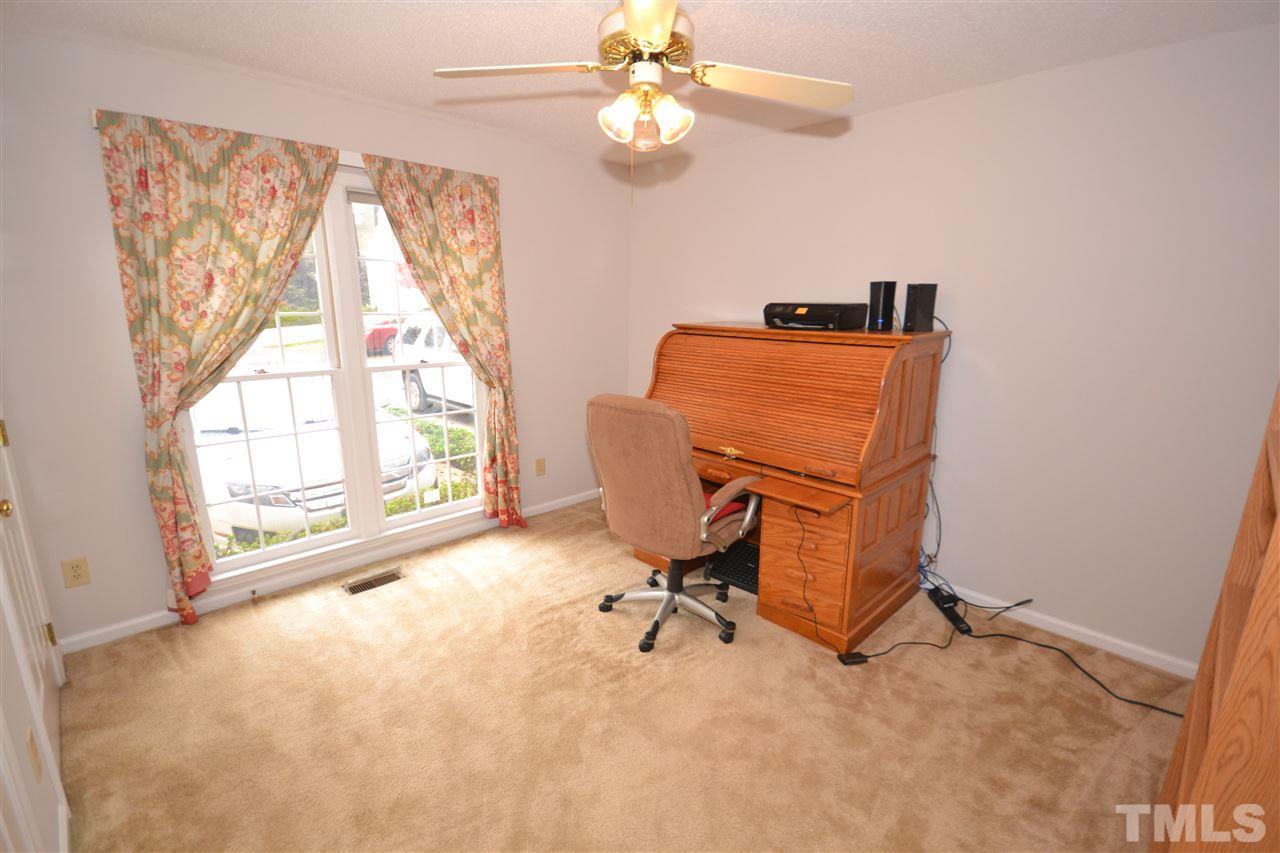 24 Renwick Court Raleigh, NC 27615 - Photo 11 of 20 a view of a workspace with furniture and a window