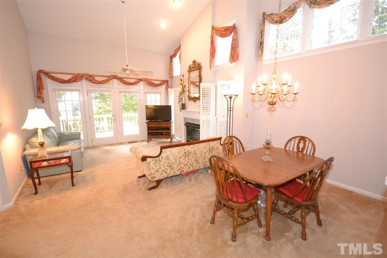 24 Renwick Court Raleigh, NC 27615 - Photo 5 of 20 a living room with furniture and a large window