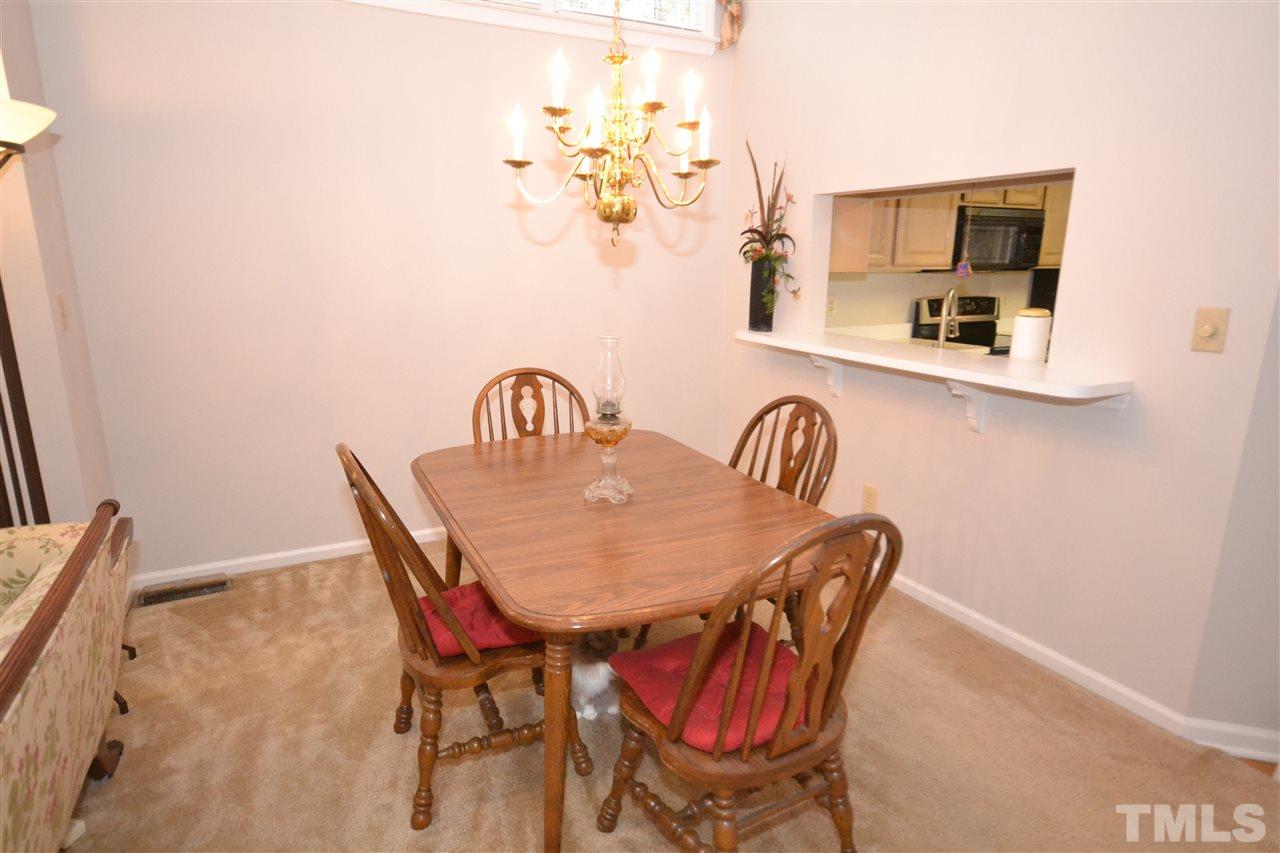 24 Renwick Court Raleigh, NC 27615 - Photo 6 of 20 a dining room with furniture and wooden floor