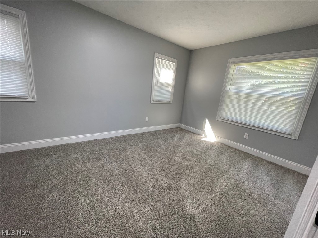 1857 Sterling Road Madison, OH 44057 - Photo 23 of 33 Carpeted empty room featuring plenty of natural light