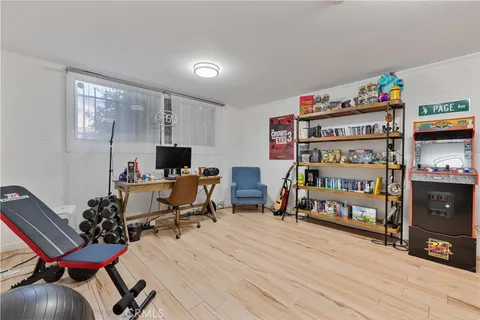 a reading room with furniture window and wooden floor