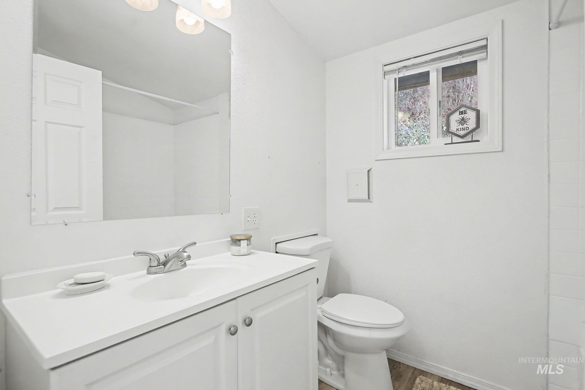 150 Elm Street Orofino, ID 83544 - Photo 13 of 36 Bathroom featuring a vanity with an integrated sink, silver-tone faucet, and under-sink storage