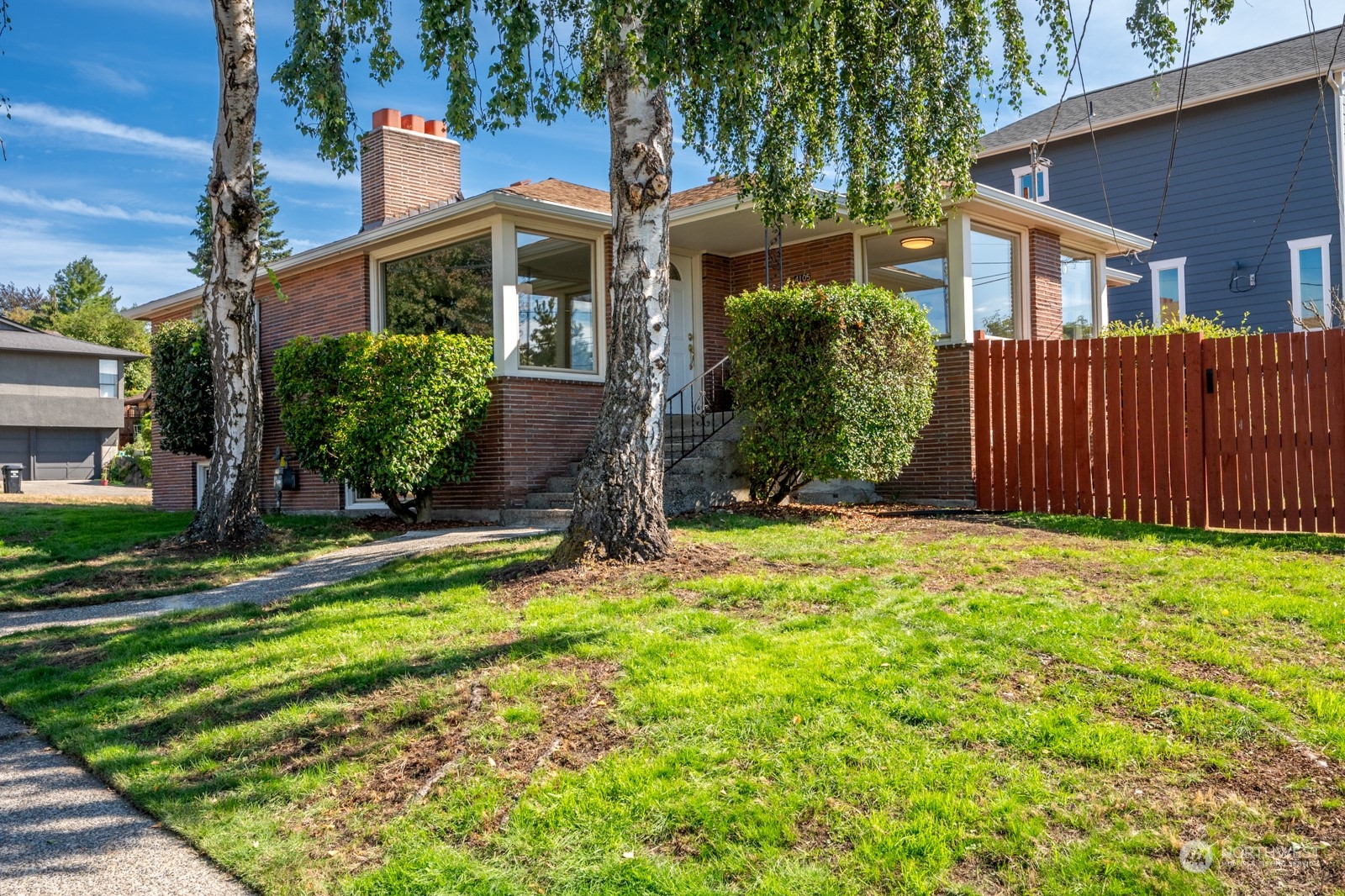 4105 Southwest Monroe Street Seattle, WA 98136 - Photo 1 of 31 a view of a house with a yard and plants