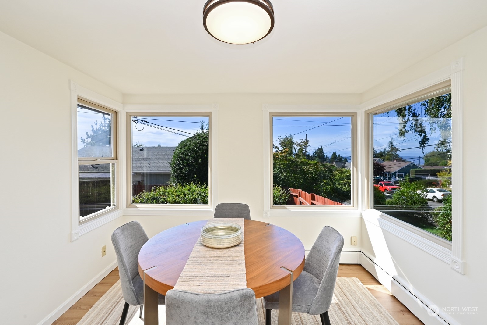 4105 Southwest Monroe Street Seattle, WA 98136 - Photo 11 of 31 a view of a dining room with furniture window and wooden floor
