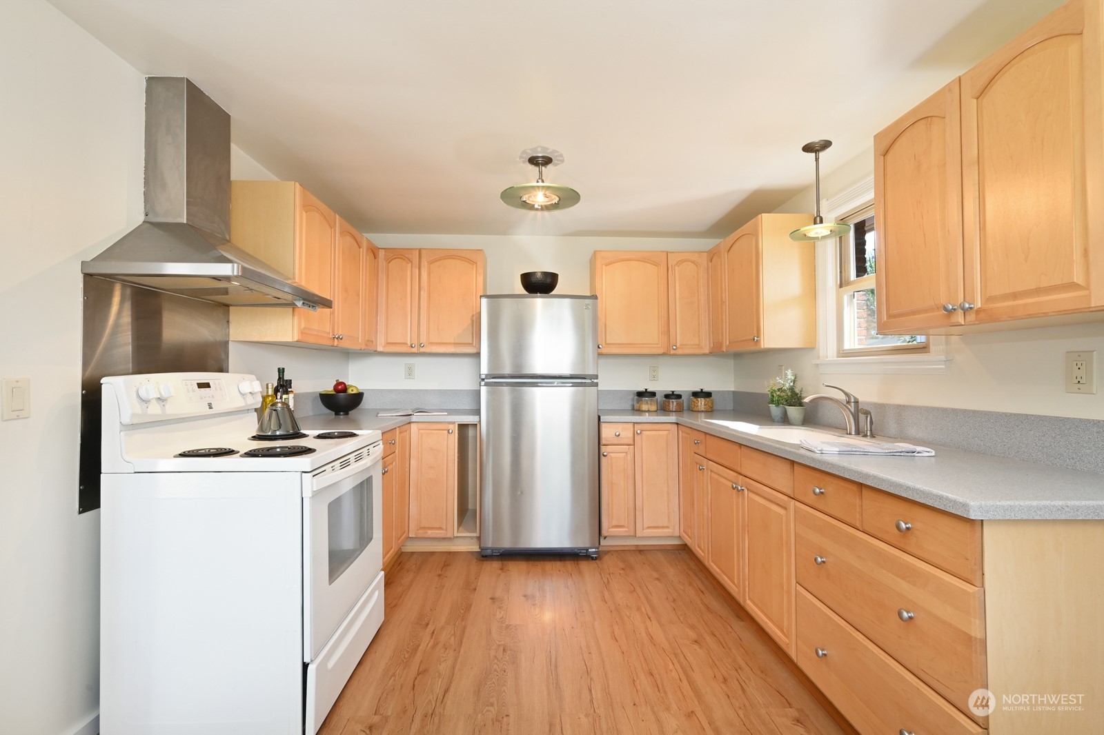 4105 Southwest Monroe Street Seattle, WA 98136 - Photo 14 of 31 a kitchen with a stove a sink and a refrigerator