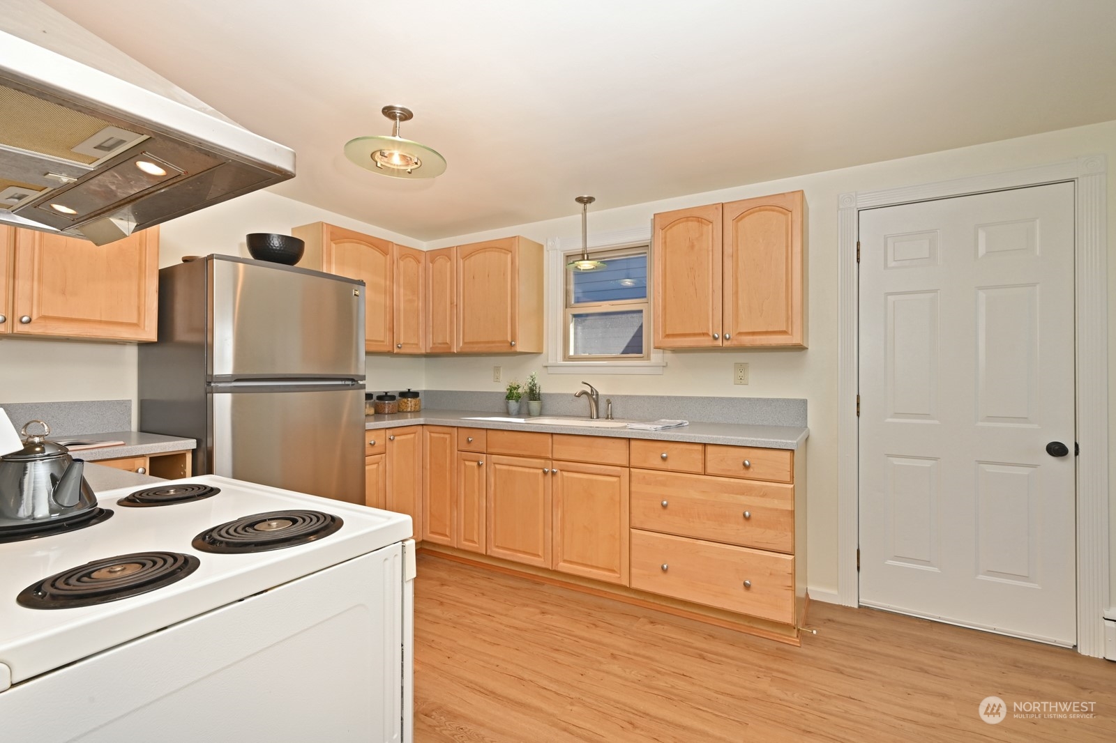 4105 Southwest Monroe Street Seattle, WA 98136 - Photo 15 of 31 a kitchen with a refrigerator sink and cabinets