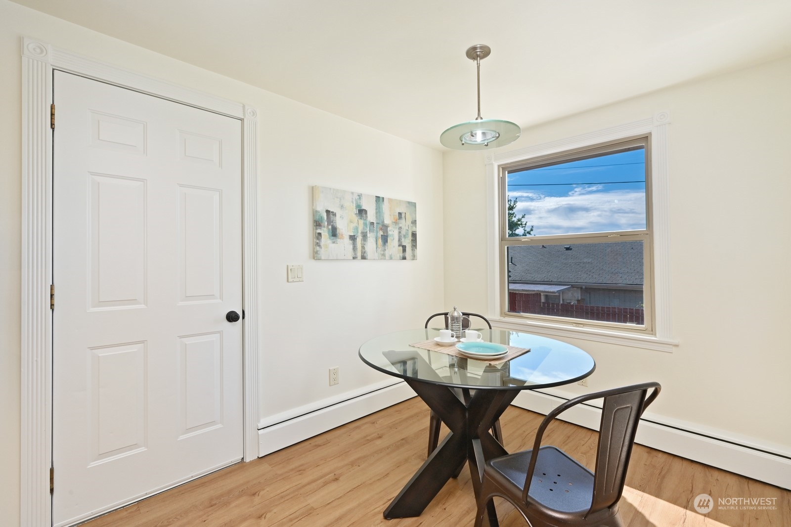 4105 Southwest Monroe Street Seattle, WA 98136 - Photo 16 of 31 a view of a dining room with furniture window and wooden floor