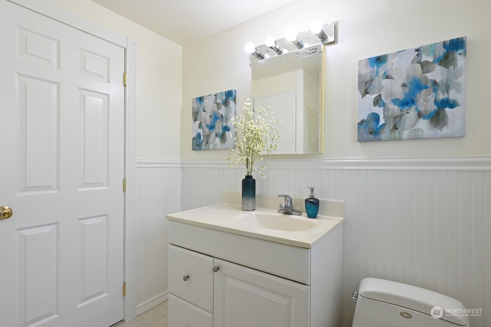 4105 Southwest Monroe Street Seattle, WA 98136 - Photo 19 of 31 a bathroom with a sink mirror and vanity