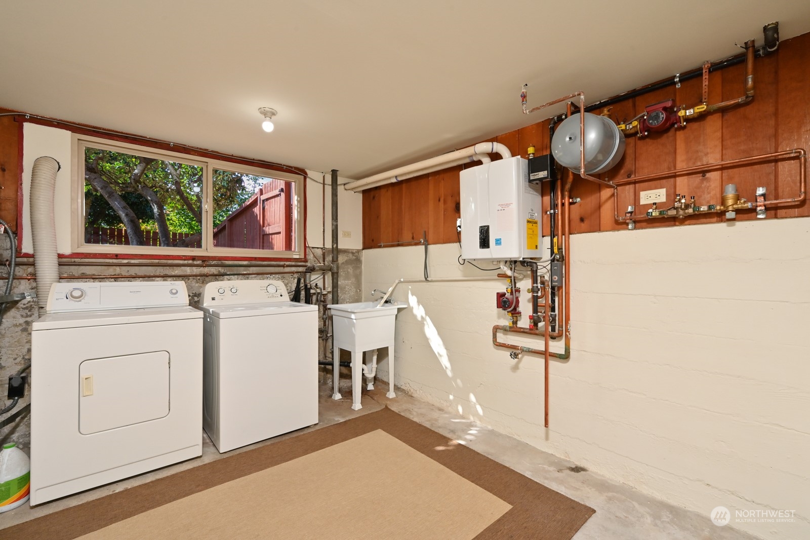 4105 Southwest Monroe Street Seattle, WA 98136 - Photo 25 of 31 a kitchen with stainless steel appliances granite countertop a stove a sink and a microwave