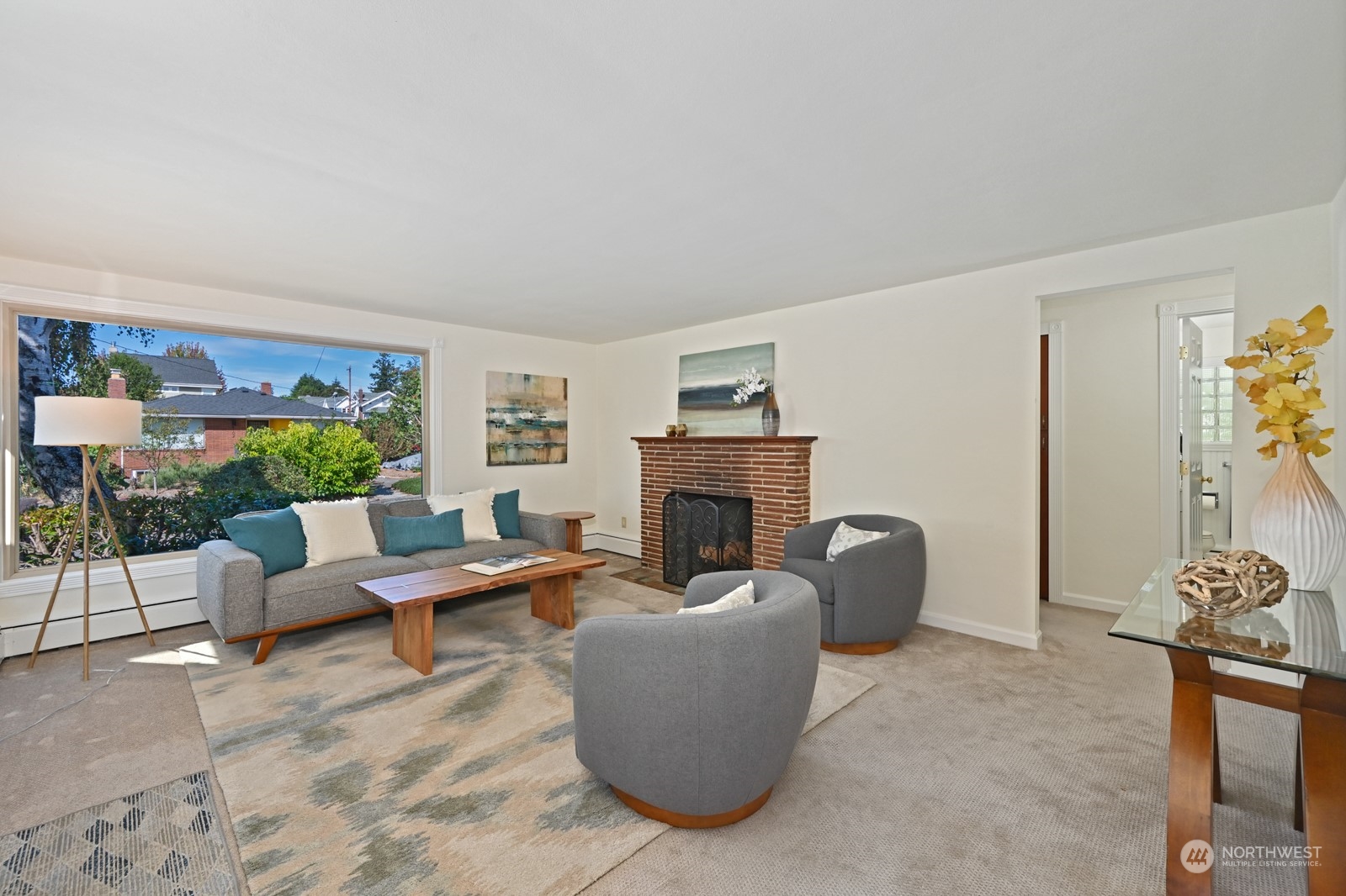 4105 Southwest Monroe Street Seattle, WA 98136 - Photo 9 of 31 a living room with furniture a fireplace and a potted plant