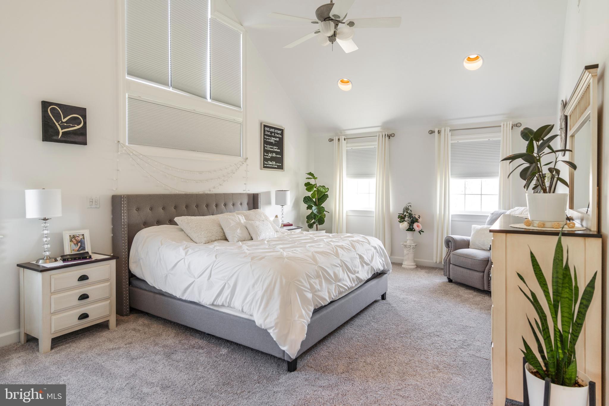 3020 Meadow View Road Manheim, PA 17545 - Photo 30 of 108 a spacious bedroom with a bed a couch and a potted plant