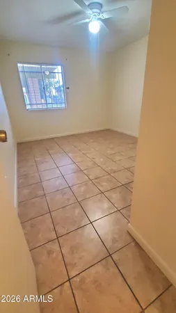 a view of an empty room and window