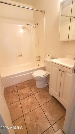 a bathroom with a toilet a sink and bathtub