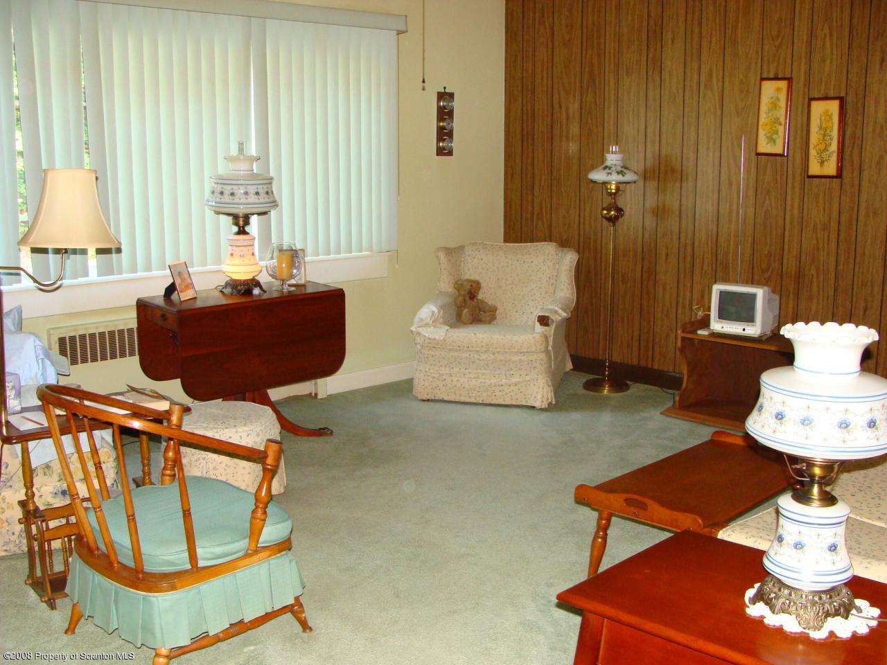 1571 East Mountain Road Scranton, PA 18505 - Photo 2 of 8 a living room with furniture and a table