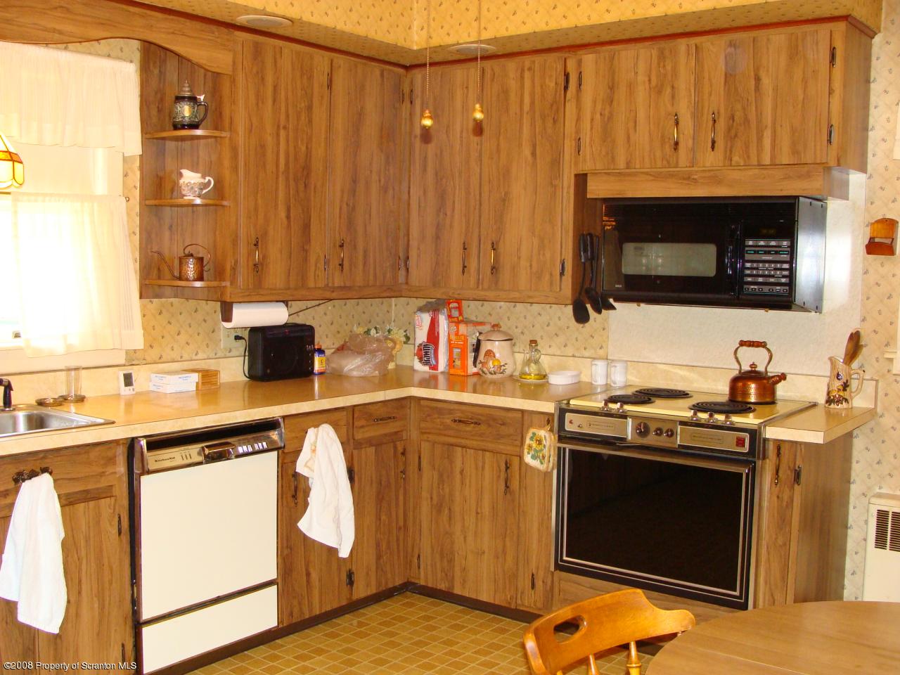 1571 East Mountain Road Scranton, PA 18505 - Photo 3 of 8 a kitchen with stainless steel appliances a stove a sink and a microwave