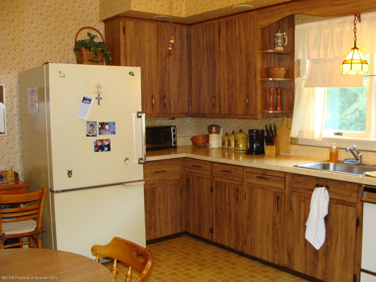 1571 East Mountain Road Scranton, PA 18505 - Photo 4 of 8 a kitchen with a refrigerator and a sink