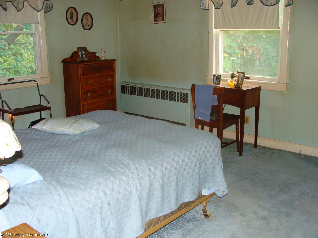 1571 East Mountain Road Scranton, PA 18505 - Photo 6 of 8 a bedroom with a bed and a window